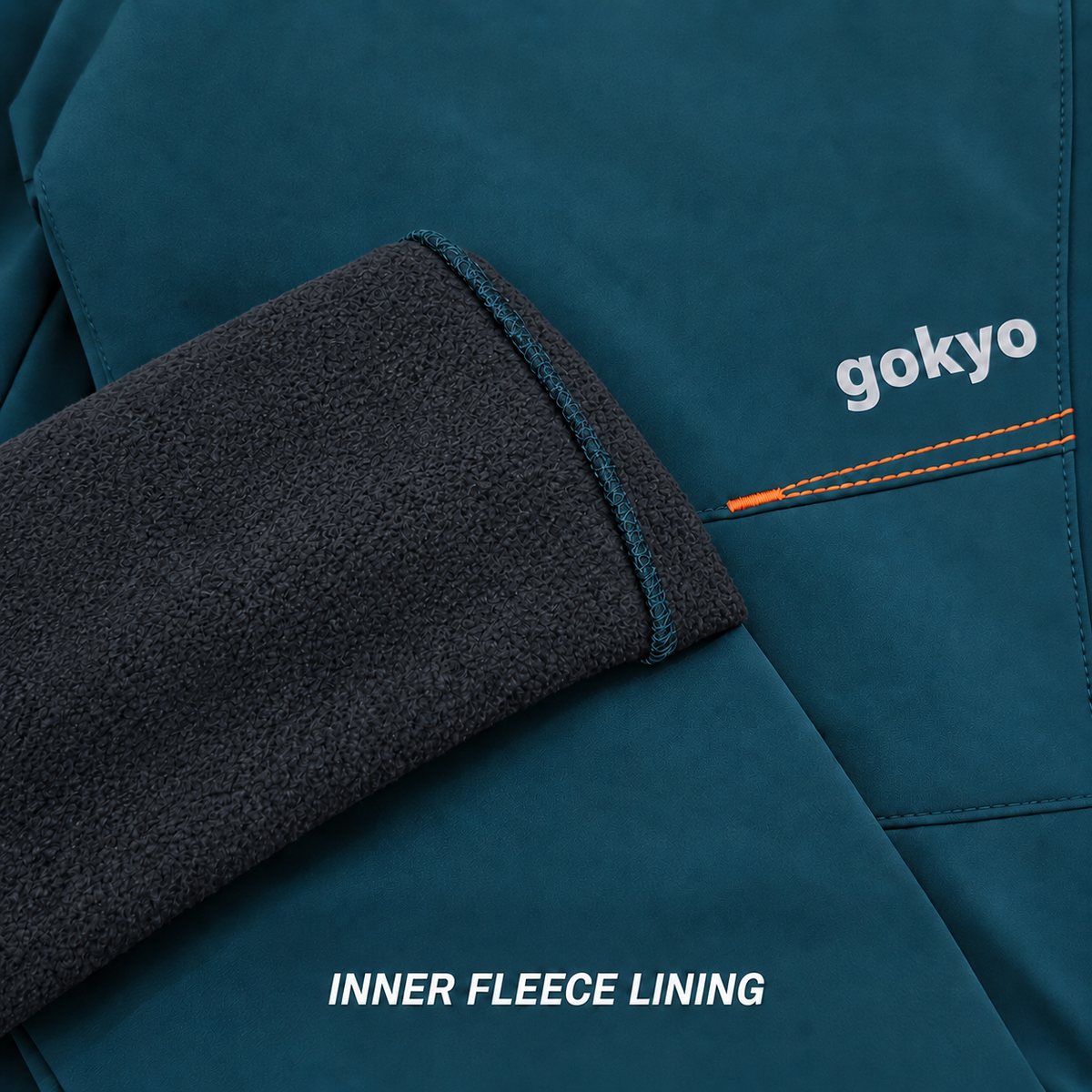 Close-up of Gokyo Aurora teal softshell fabric and warm inner fleece lining