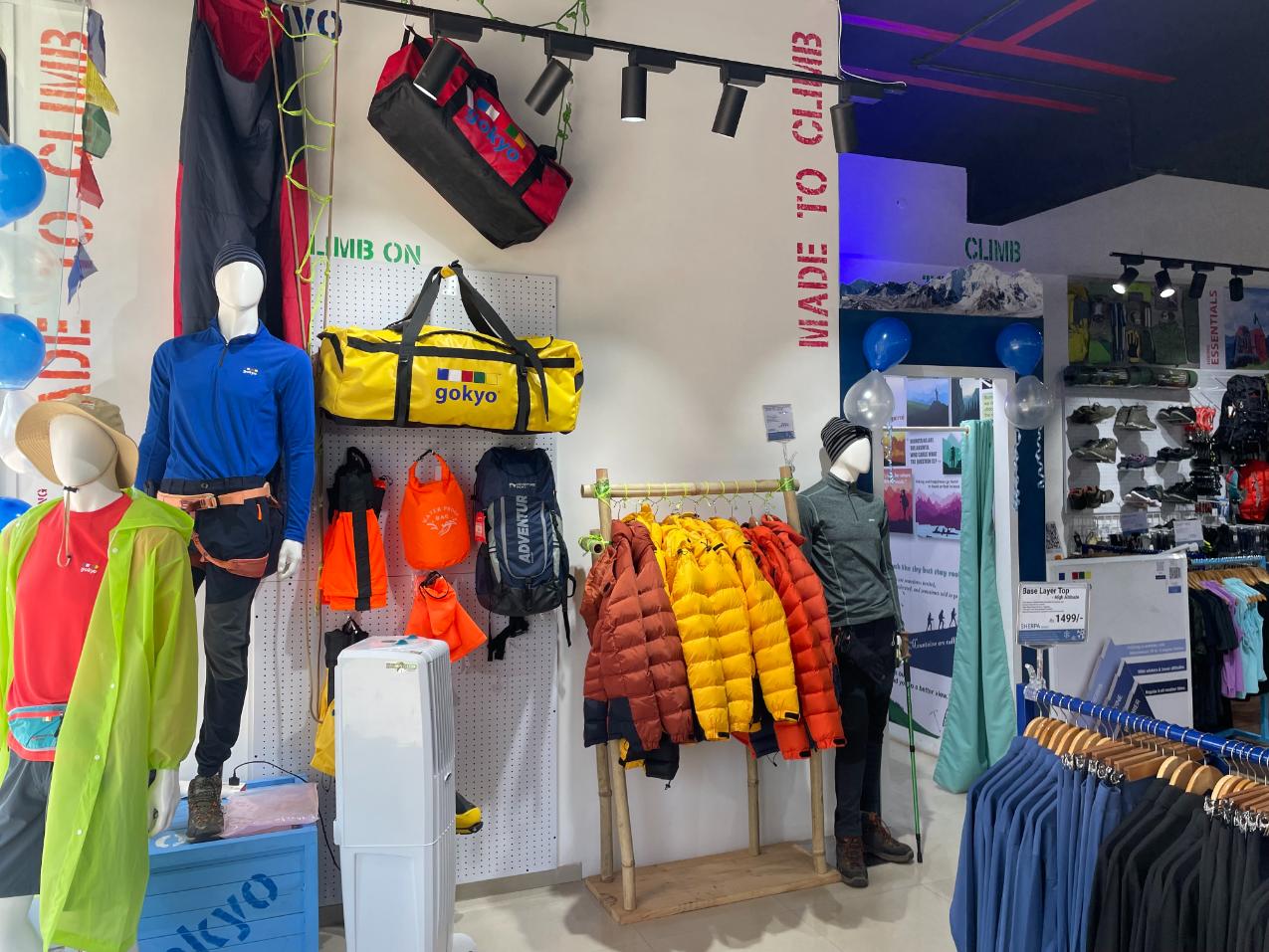 Clothing racks with trekking essentials at Gokyo Outdoor Clothing & Gear Malad store.