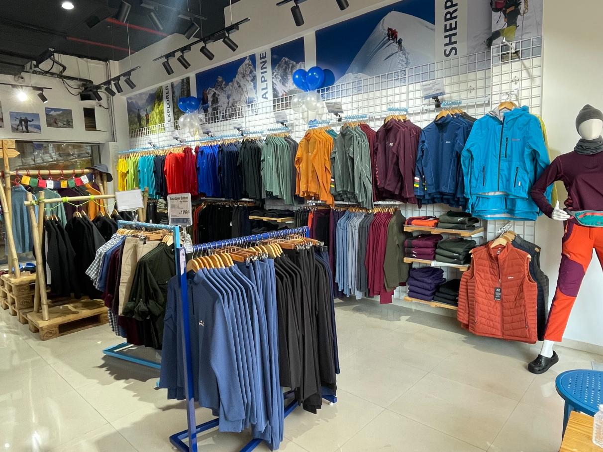 Interior view showing various product sections at Gokyo Outdoor Clothing & Gear Malad store.
